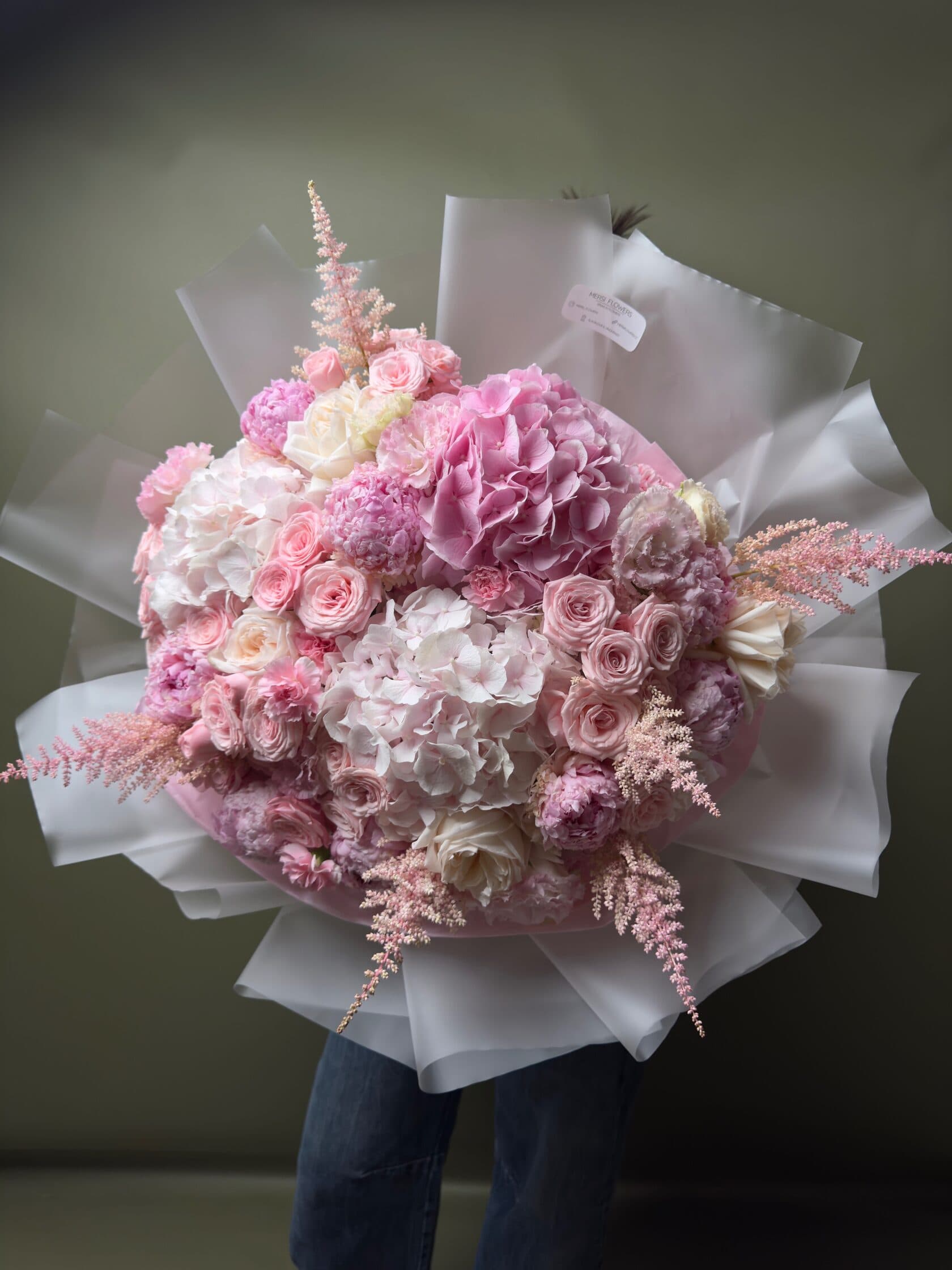 Voluminous Elegy bouquet of hydrangea, garden roses, spray roses and astilbe