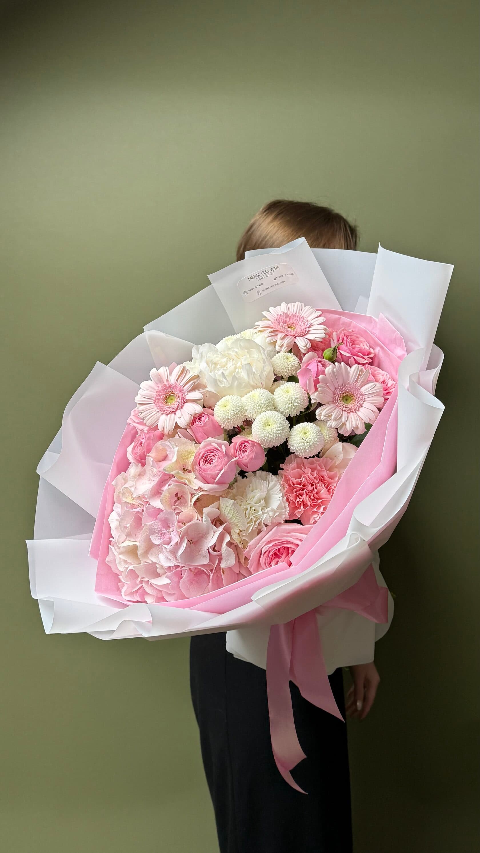 Form bouquet of peonies, peony roses, hydrangea, gerberas and chrysanthemums