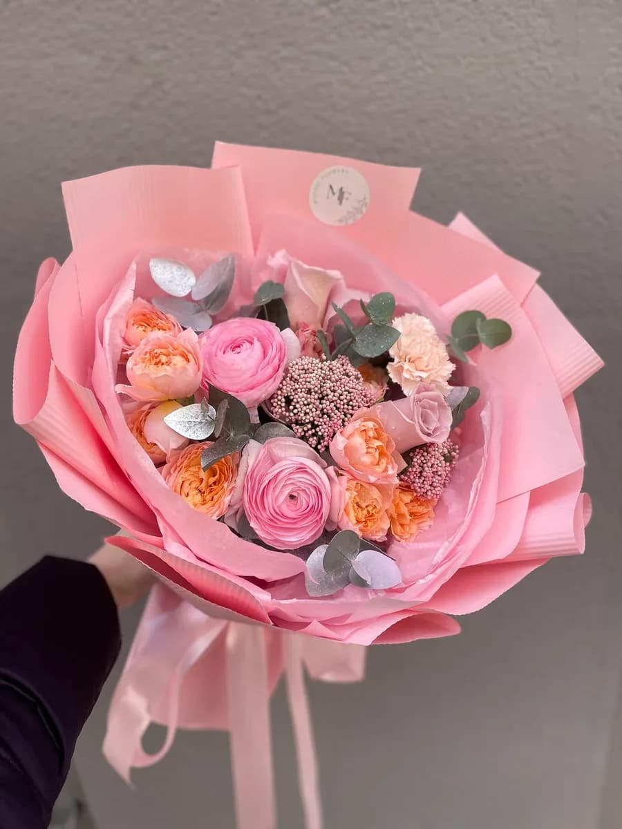 Compliment bouquet of Juliet roses, ranunculus, carnations and eucalyptus in pastel tones