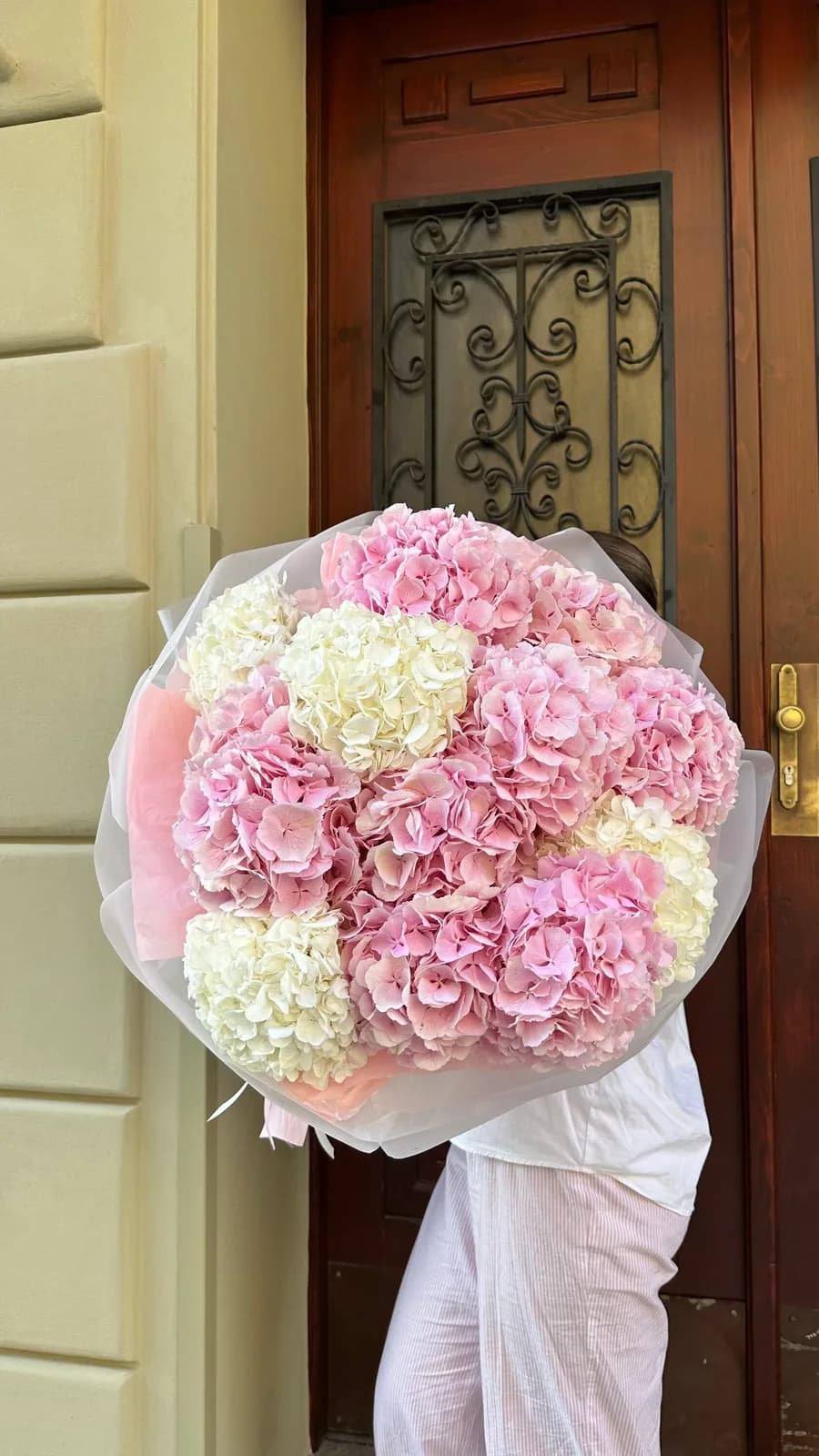 Cloud sky mono bouquet of giant pink and yellow hydrangeas