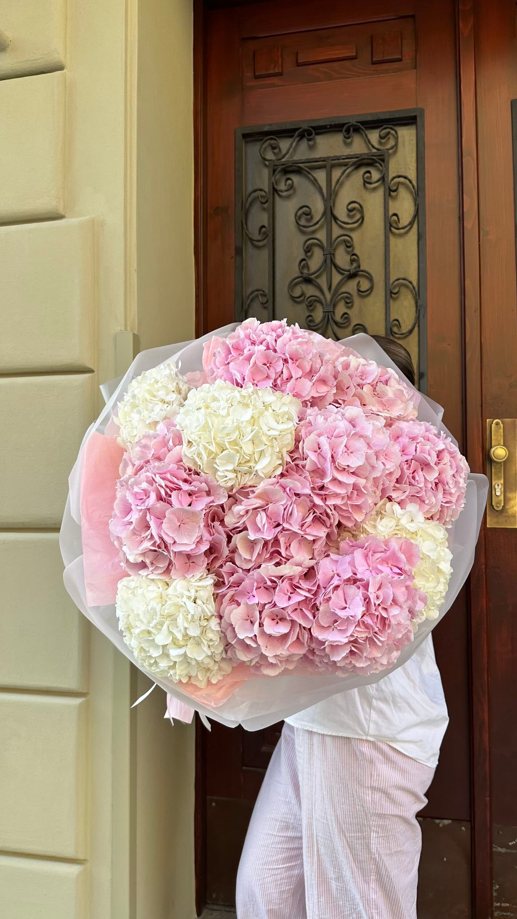 Cloud sky mono bouquet of giant pink and yellow hydrangeas