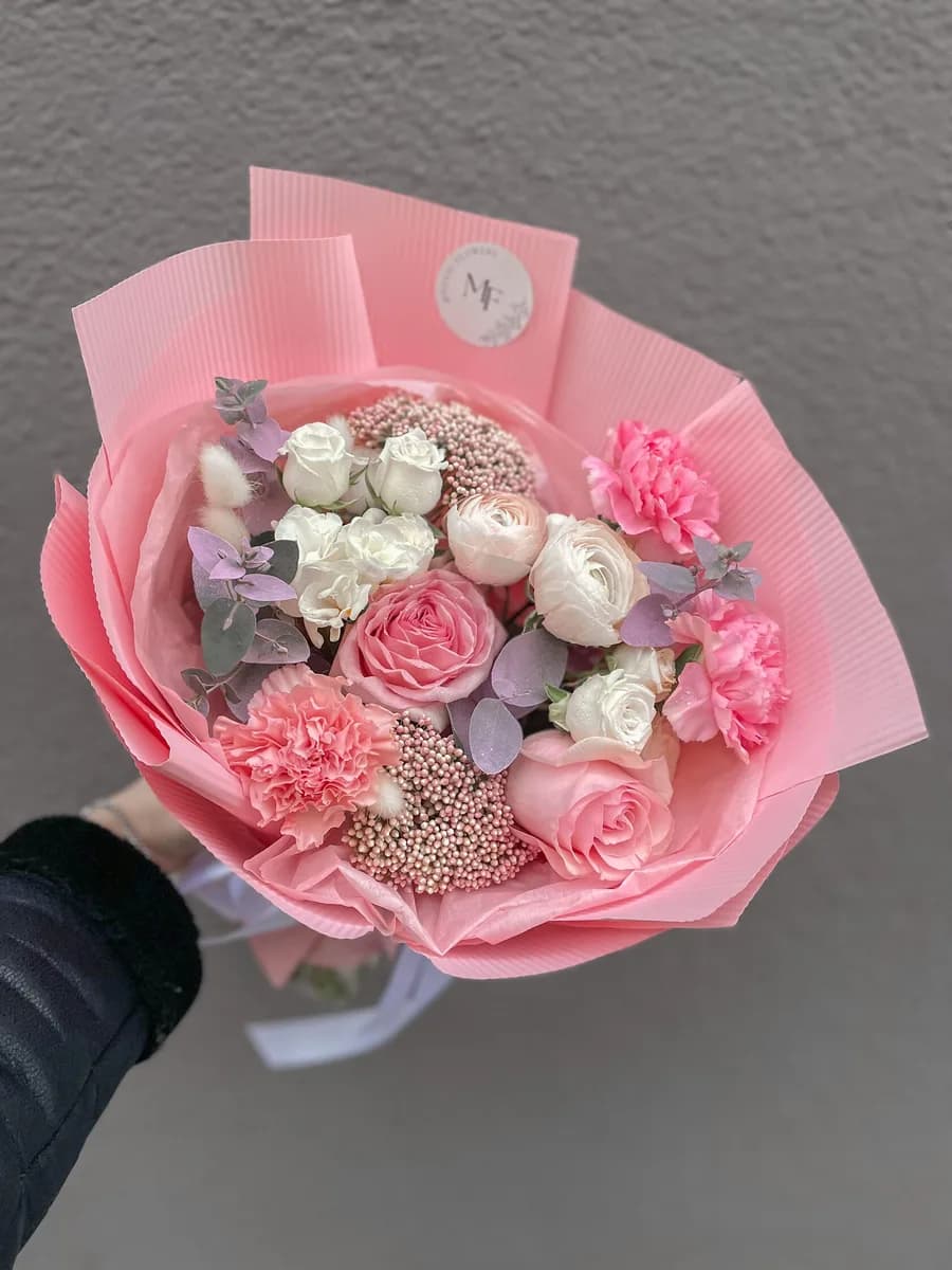Feel bouquet of pink and white roses, ranunculus and carnations