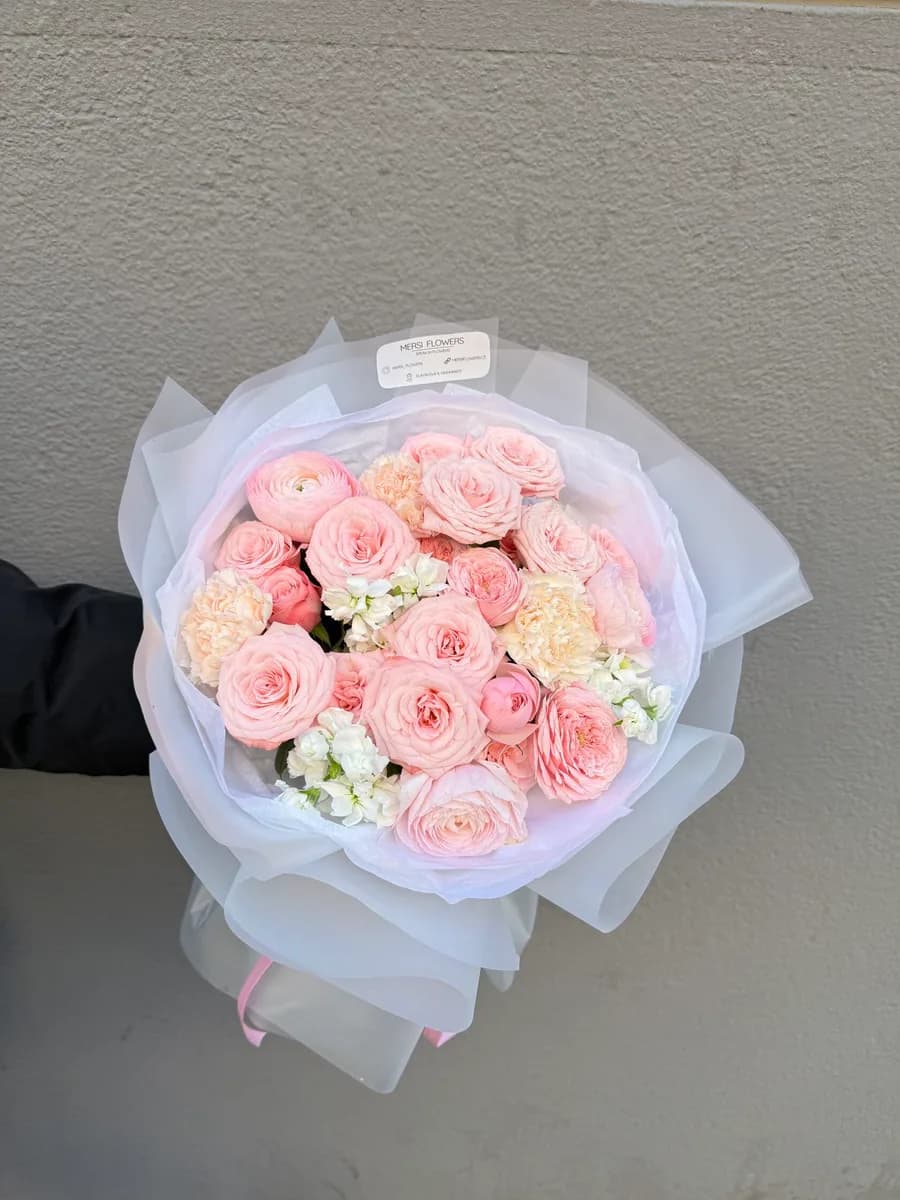 A Sense of Closeness bouquet of spray roses, ranunculus, carnations and stock
