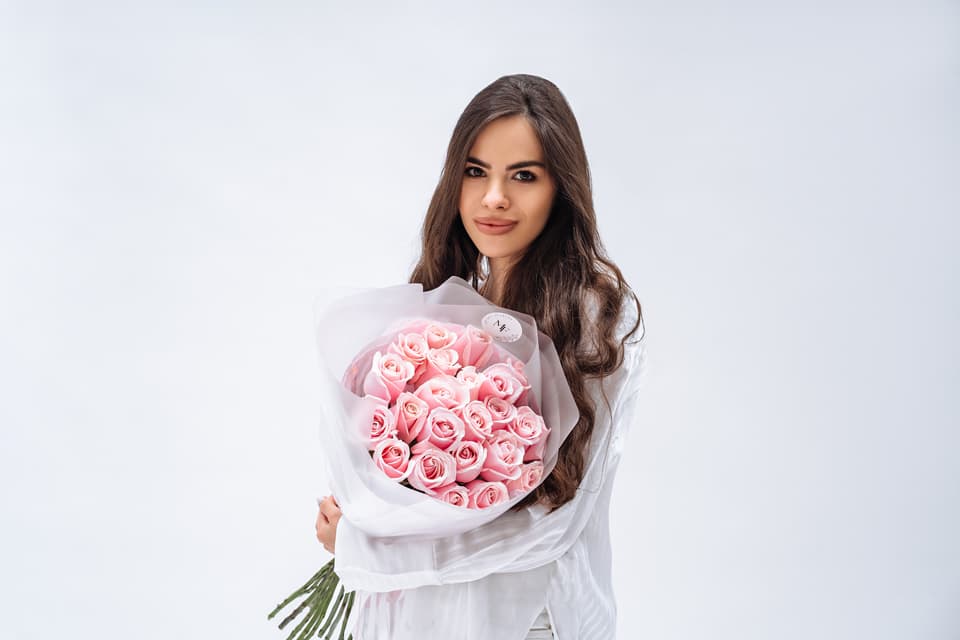 Bouquet of pink roses in decorative wrapping
