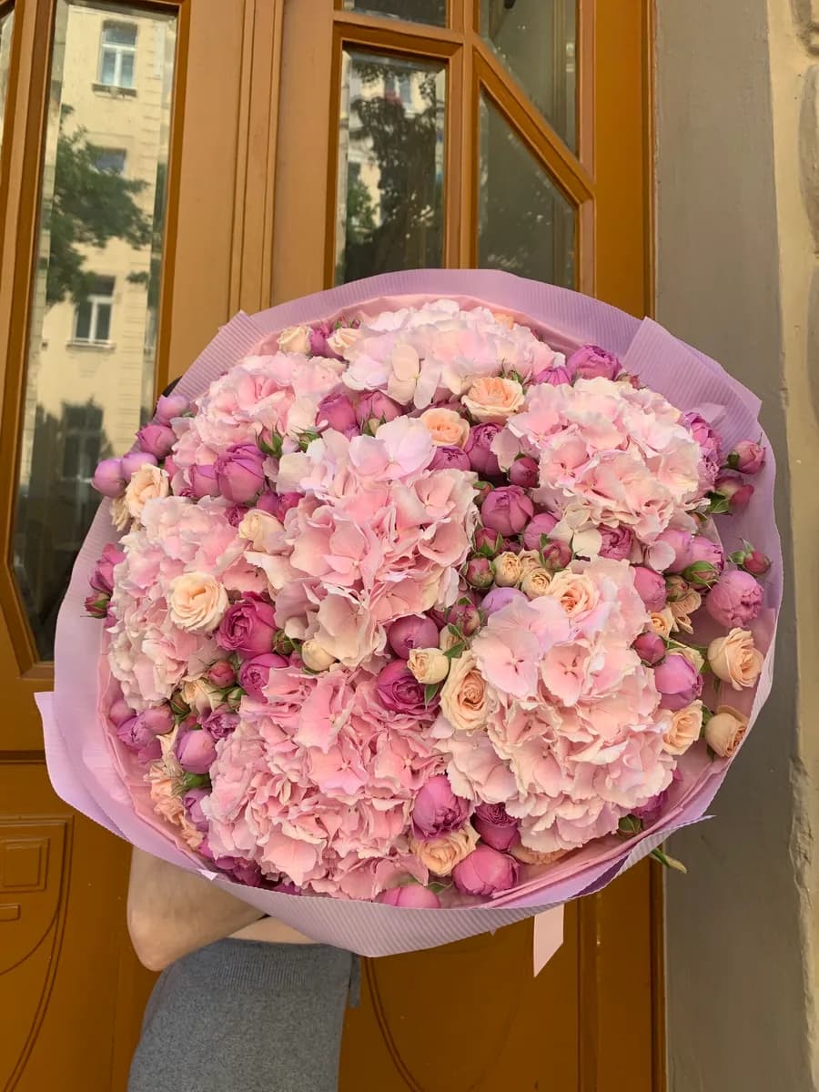 Blush bouquet of pink hydrangeas with pink and cream spray roses