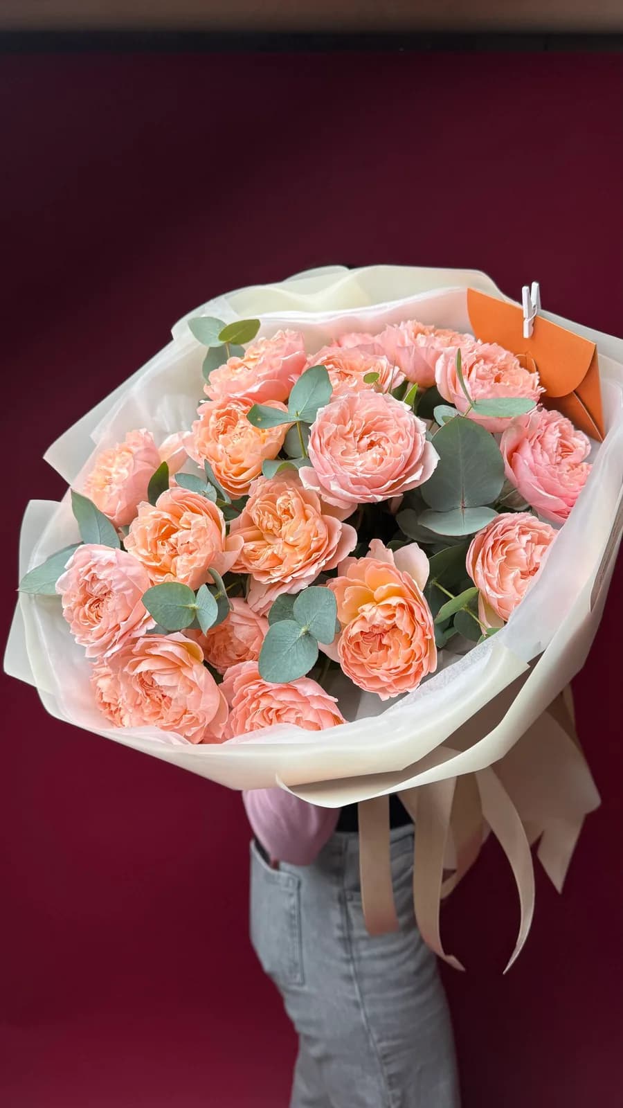 Apricot Muse bouquet of apricot garden roses and eucalyptus in cream paper
